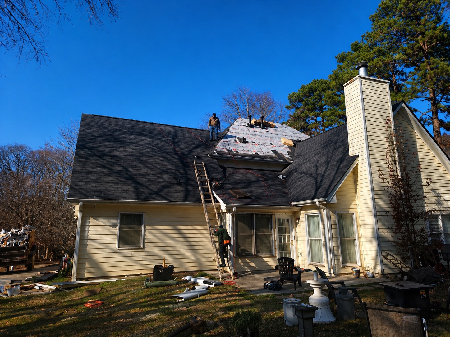 Side view of home with new dark shingle roof installed